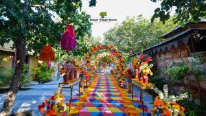 Colorful floral wedding pathway at nature village resort