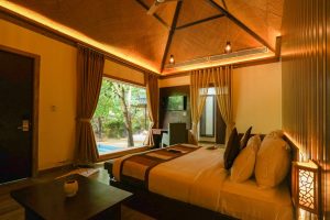 Elegant luxury villa room with garden view and warm lighting