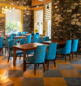 Couple enjoying a romantic candlelight dinner at the restaurant of Nature Village Resort, the best honeymoon resort in Pushkar, offering luxury dining and authentic Rajasthani hospitality.